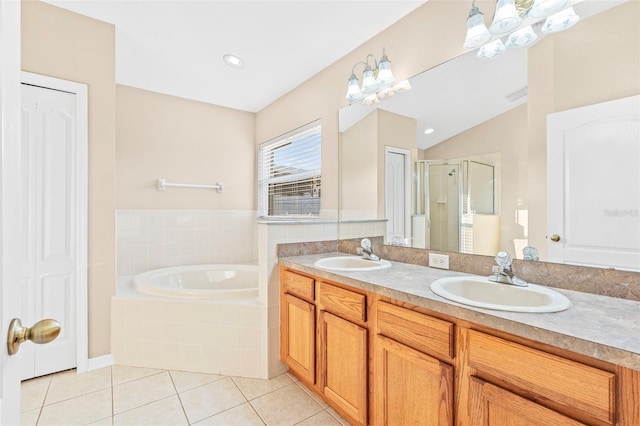 bathroom with tile patterned flooring, vanity, separate shower and tub, and lofted ceiling