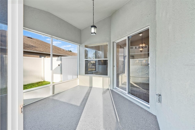 unfurnished sunroom with vaulted ceiling