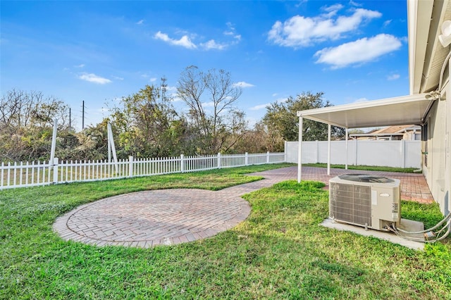 view of yard with a patio and central AC