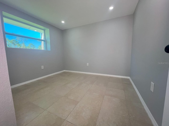 empty room featuring light tile patterned floors