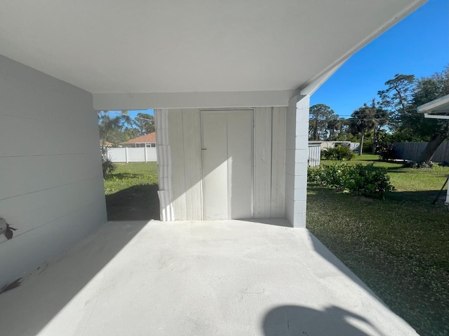 735 Bertrend St, Englewood, FL 34223 - view of patio featuring an attached carport