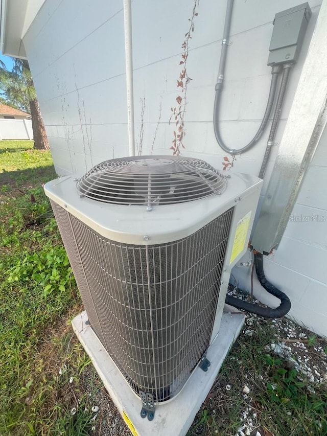 735 Bertrend St, Englewood, FL 34223 - exterior view of central AC and concrete block siding
