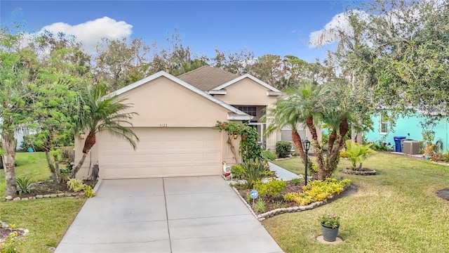 view of front of house featuring a front lawn and a garage