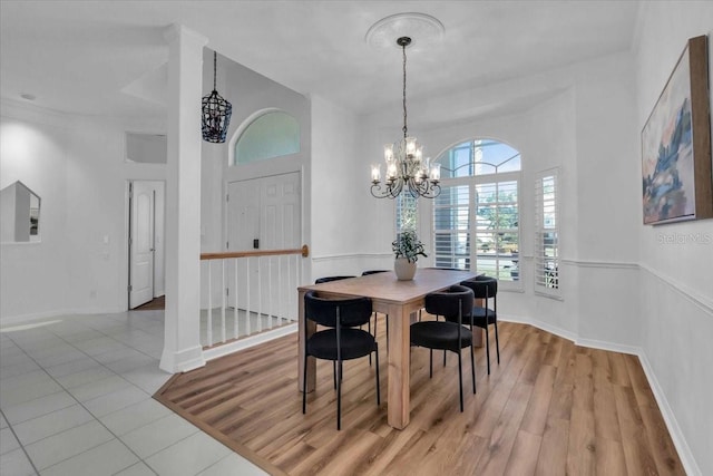 dining area featuring a notable chandelier and light hardwood / wood-style flooring