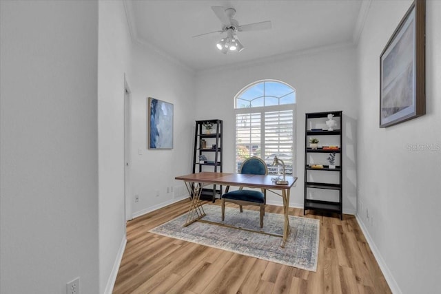 home office featuring light hardwood / wood-style floors, ceiling fan, and crown molding