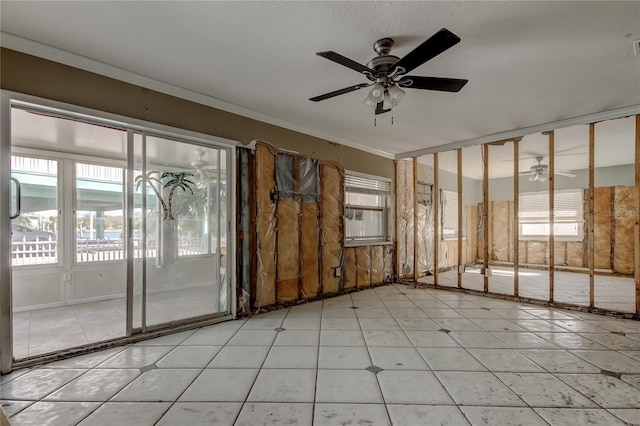 unfurnished room featuring crown molding and ceiling fan