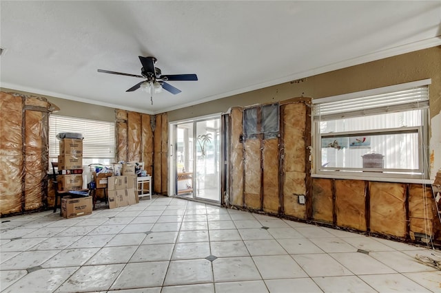 miscellaneous room featuring ceiling fan, ornamental molding, plenty of natural light, and visible vents