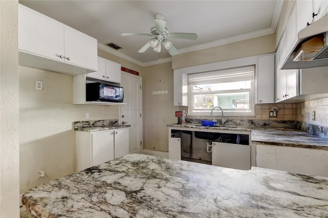 kitchen with white cabinets, light stone counters, ornamental molding, extractor fan, and black microwave