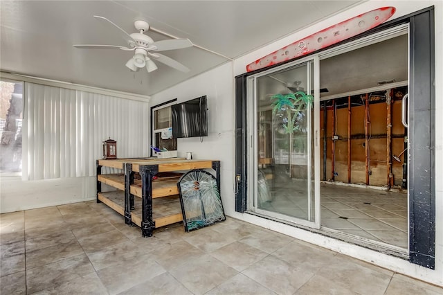 view of patio featuring ceiling fan