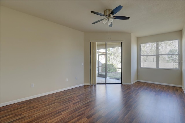 unfurnished room featuring ceiling fan and dark hardwood / wood-style floors