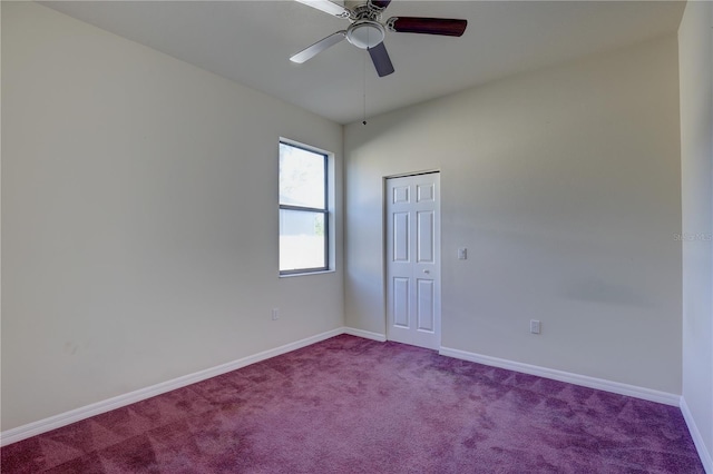 carpeted empty room with ceiling fan