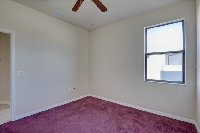 unfurnished room with ceiling fan and carpet floors