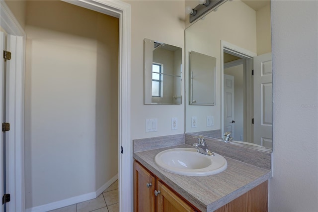 bathroom with tile patterned floors and vanity