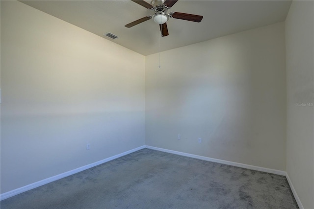 carpeted empty room featuring ceiling fan