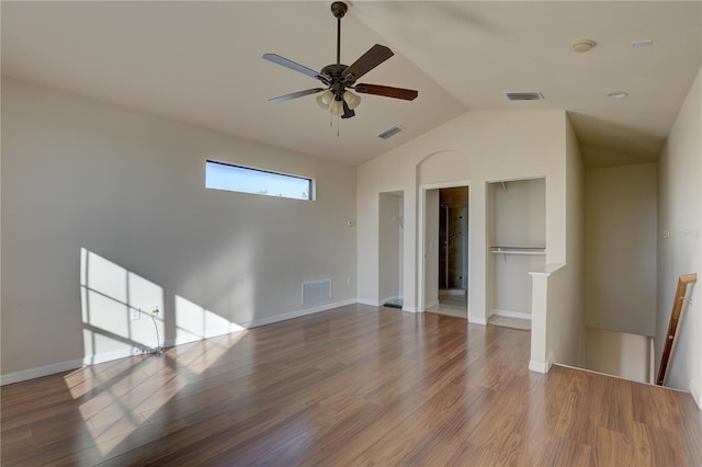 empty room featuring ceiling fan, lofted ceiling, and hardwood / wood-style flooring