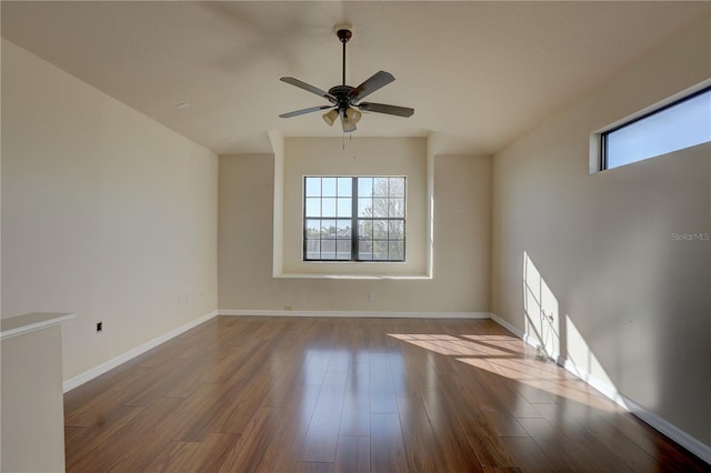 spare room with hardwood / wood-style flooring and ceiling fan