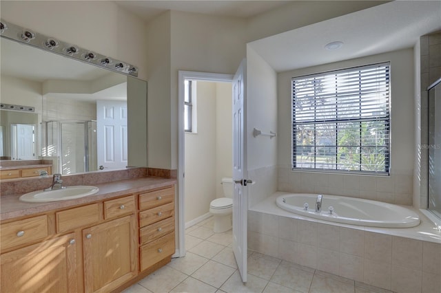 full bathroom with tile patterned floors, plenty of natural light, toilet, and vanity