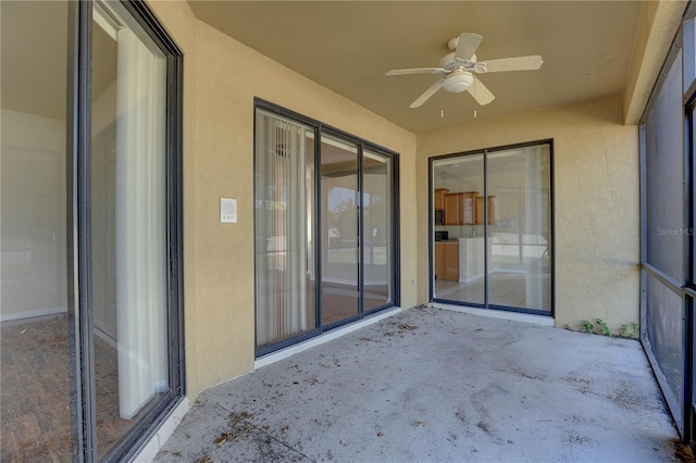 view of patio featuring ceiling fan