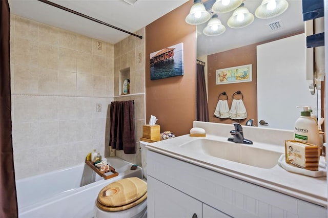 full bathroom featuring shower / bath combo with shower curtain, vanity, and toilet