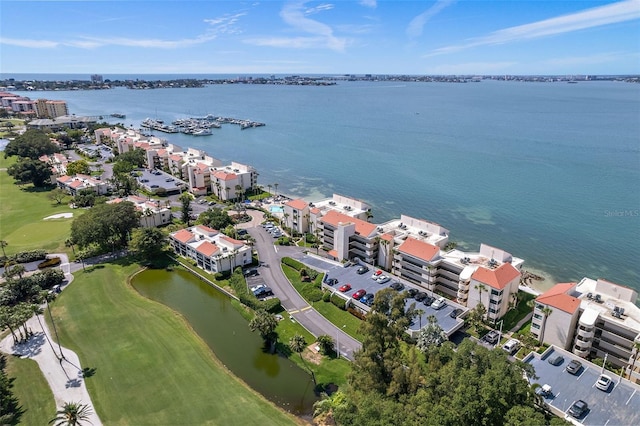 bird's eye view with view of golf course and a water view