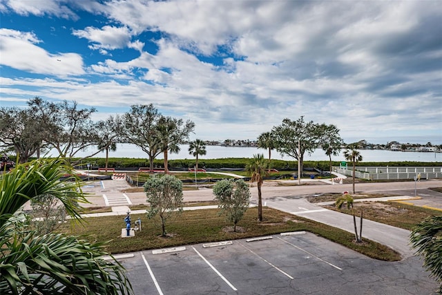 view of community with a water view