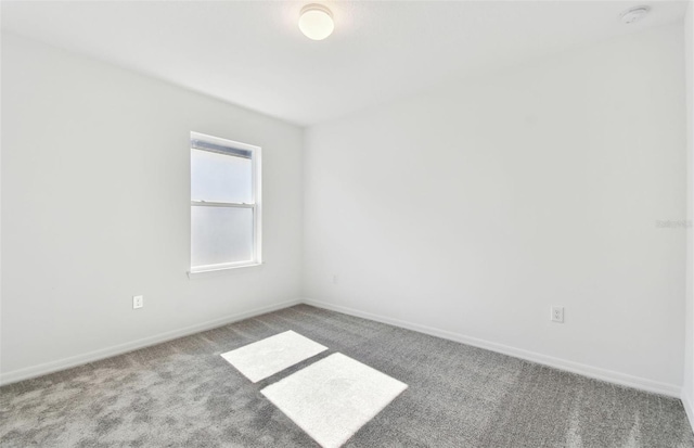 unfurnished room featuring carpet flooring