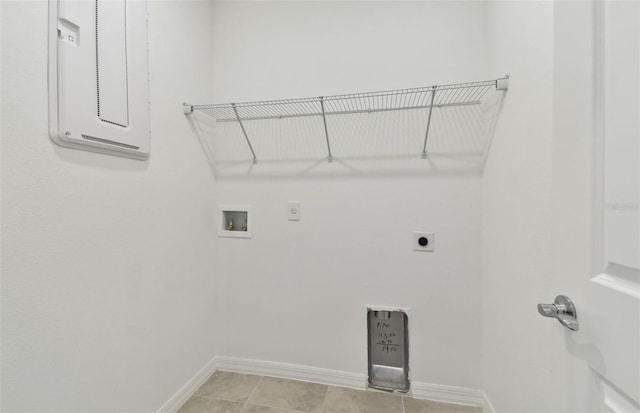 laundry room with hookup for a washing machine, electric dryer hookup, and light tile patterned floors