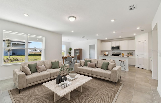 living room featuring light tile patterned flooring