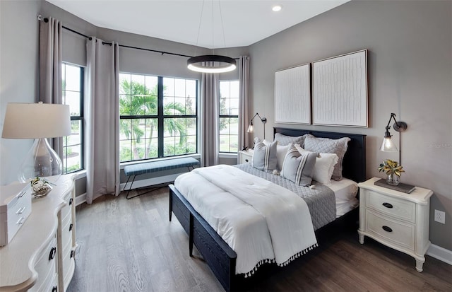 bedroom featuring dark hardwood / wood-style flooring