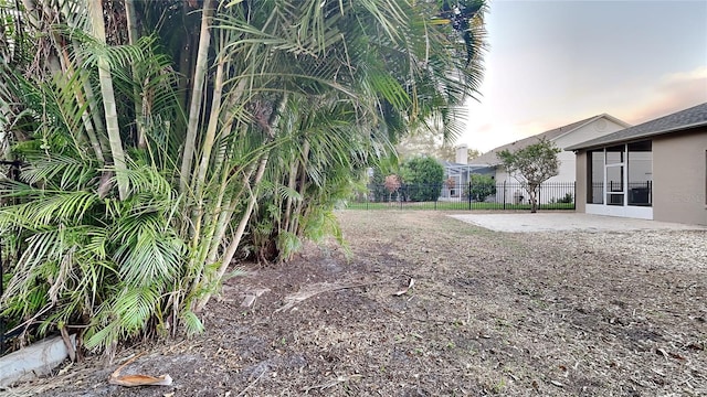 view of yard at dusk