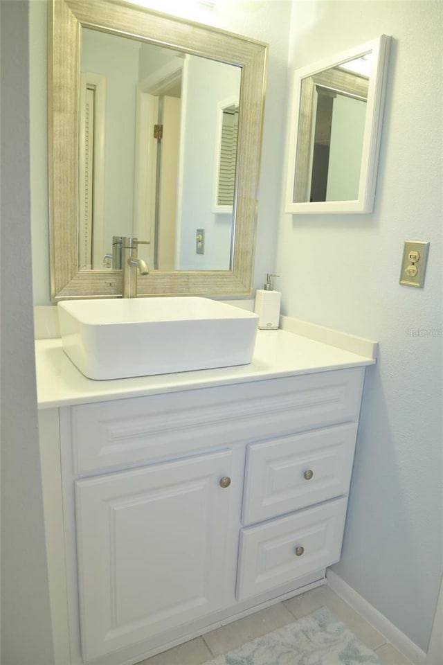 bathroom featuring tile patterned floors and vanity