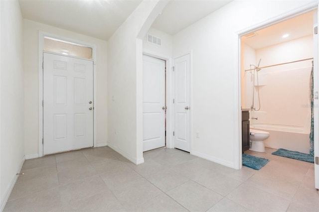 entrance foyer with light tile patterned floors