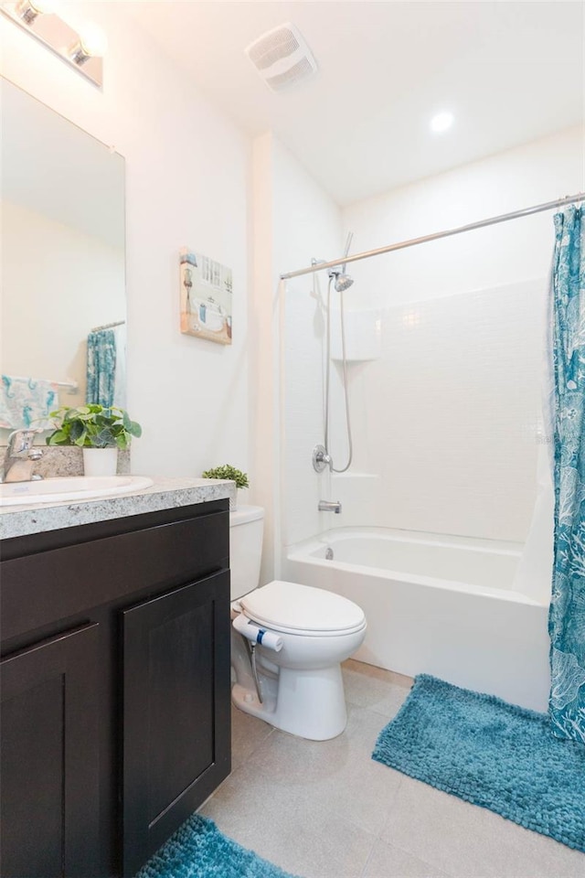 full bathroom featuring shower / bath combo, vanity, and toilet