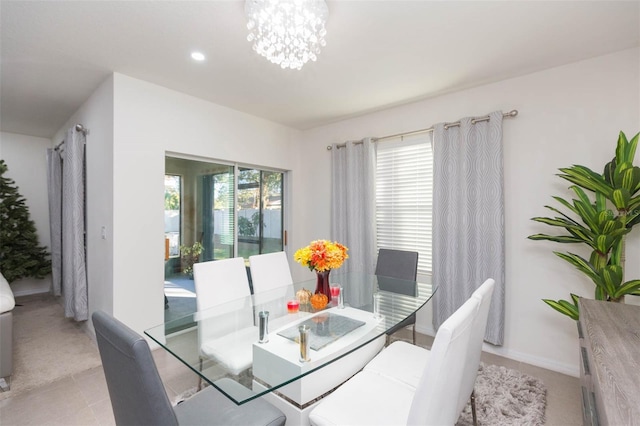 dining area with an inviting chandelier