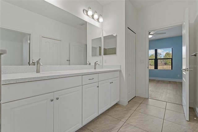 bathroom featuring wood-type flooring, vanity, and ceiling fan