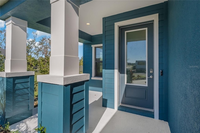 doorway to property with covered porch