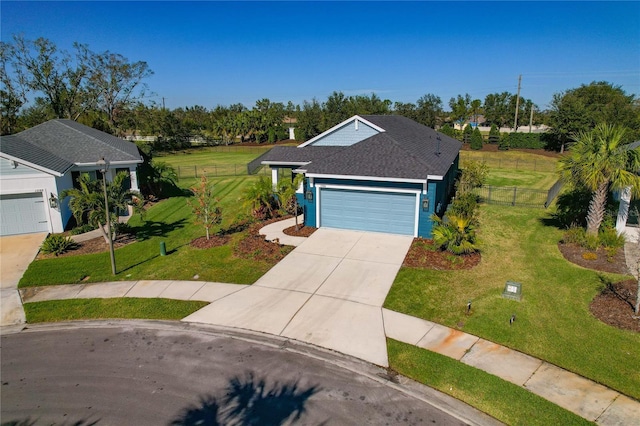 ranch-style home featuring a garage and a front yard