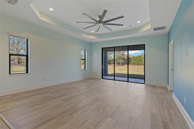 13584 Old Creek Ct, Parrish, FL 34219 - unfurnished room featuring a raised ceiling, ceiling fan, light wood-type flooring, recessed lighting, and baseboards