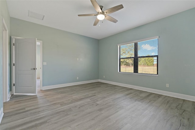 unfurnished room with ceiling fan and light hardwood / wood-style flooring