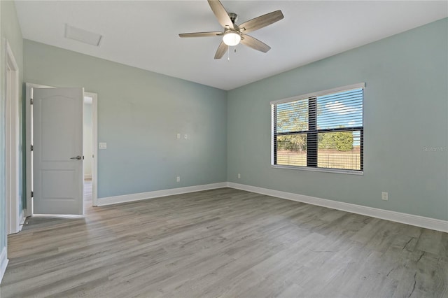 13584 Old Creek Ct, Parrish, FL 34219 - empty room featuring light wood-style flooring, baseboards, and ceiling fan
