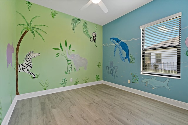 13584 Old Creek Ct, Parrish, FL 34219 - unfurnished room featuring wood finished floors, baseboards, and a ceiling fan