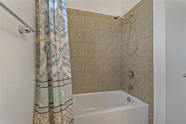 bathroom with shower / bath combination with curtain