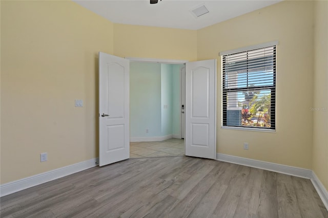 unfurnished bedroom with light hardwood / wood-style floors