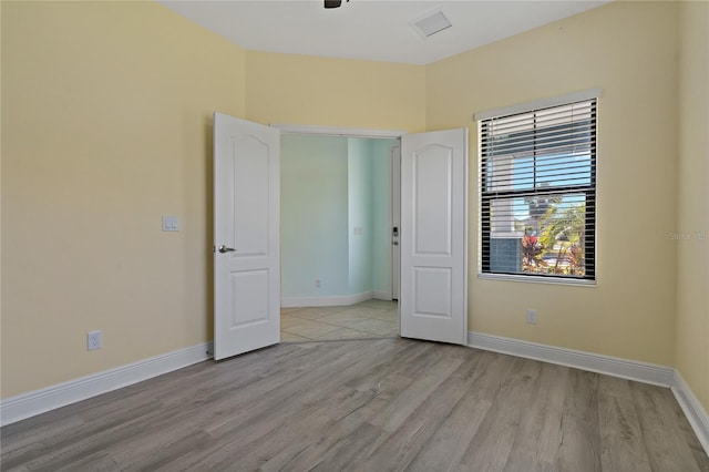 13584 Old Creek Ct, Parrish, FL 34219 - unfurnished bedroom featuring light wood-style floors and baseboards
