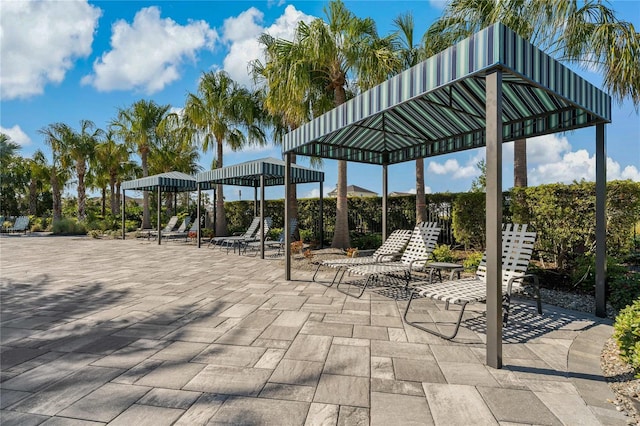 surrounding community with a gazebo and a patio area