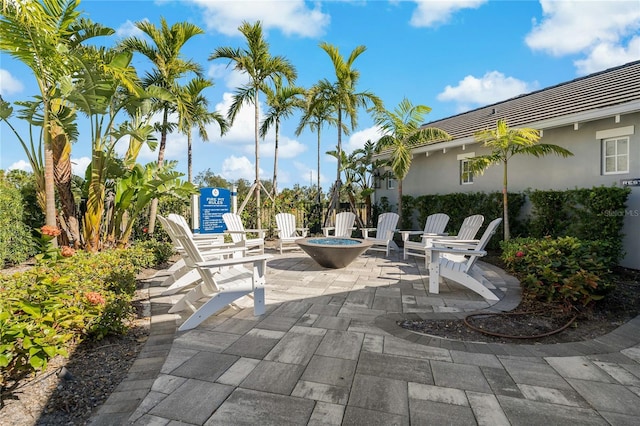 13584 Old Creek Ct, Parrish, FL 34219 - view of patio / terrace featuring a fire pit