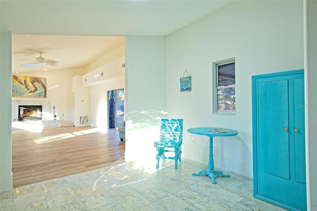 interior space with ceiling fan and light hardwood / wood-style flooring