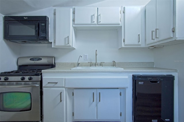 kitchen featuring black appliances, white cabinetry, and sink