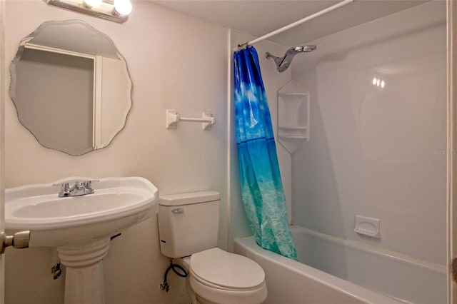 bathroom with shower / bath combo and toilet