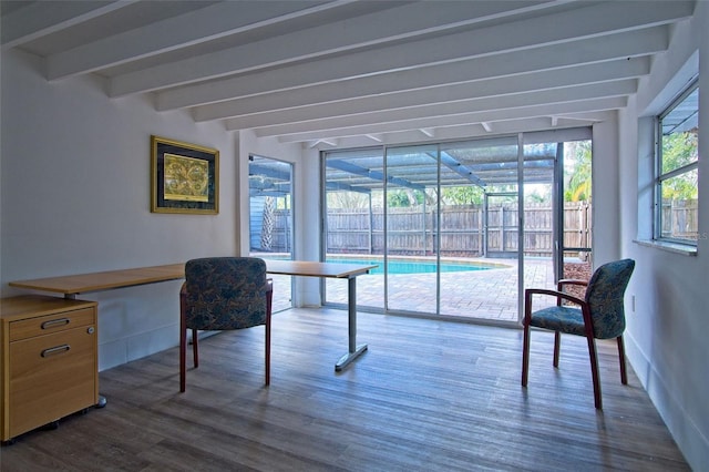 office featuring a wall of windows, beam ceiling, and dark hardwood / wood-style flooring